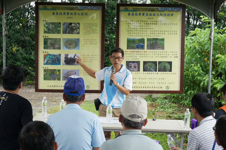 An assistant researcher speaks on pre- and post-typhoon disease management techniques.