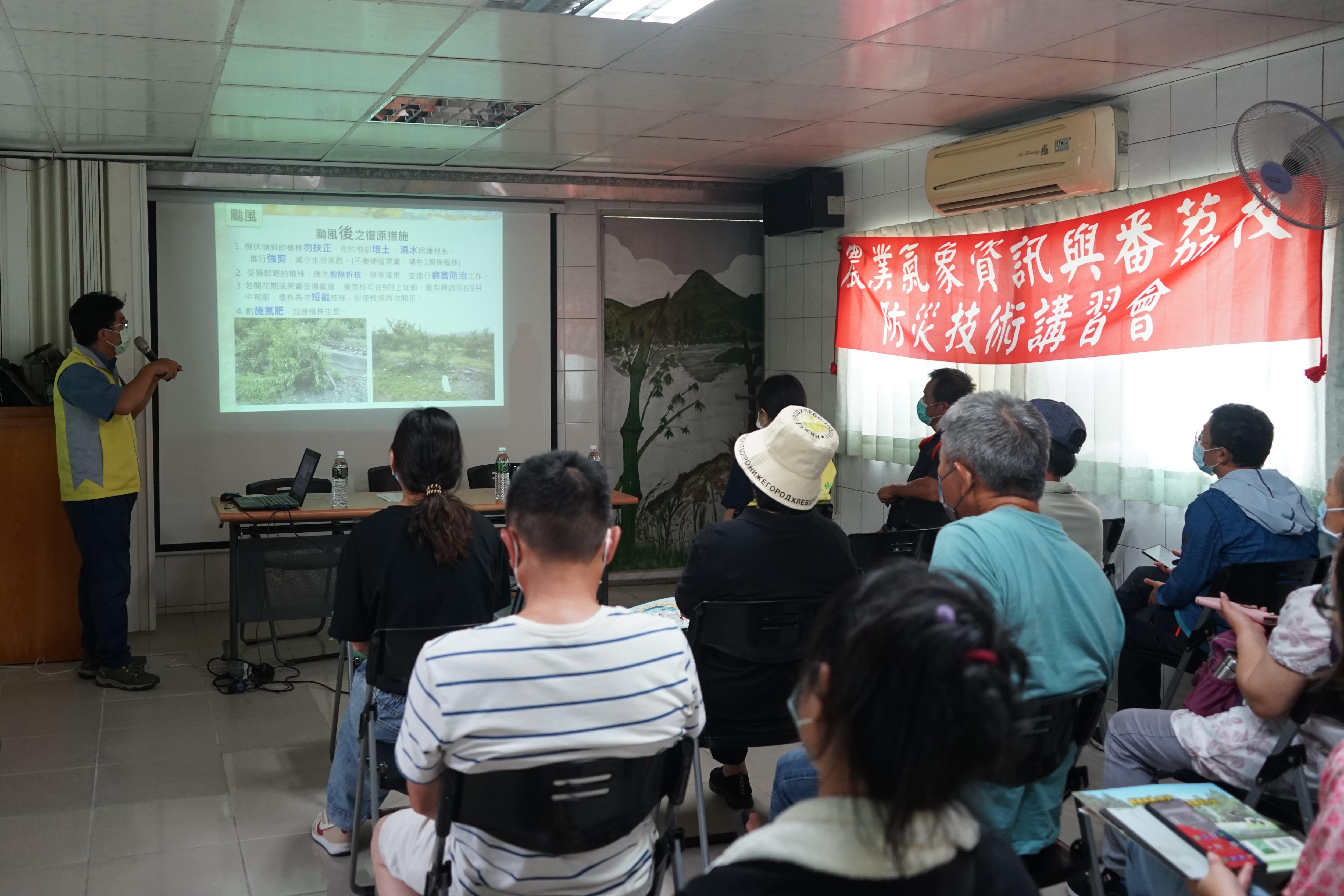 Figure 2. Attendees listening to the lecture. Figure 2. Attendees listening to the lecture.